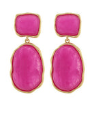 Pink earrings with gold frames on a white background