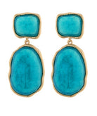 Turquoise stone earrings with gold frames on a white background