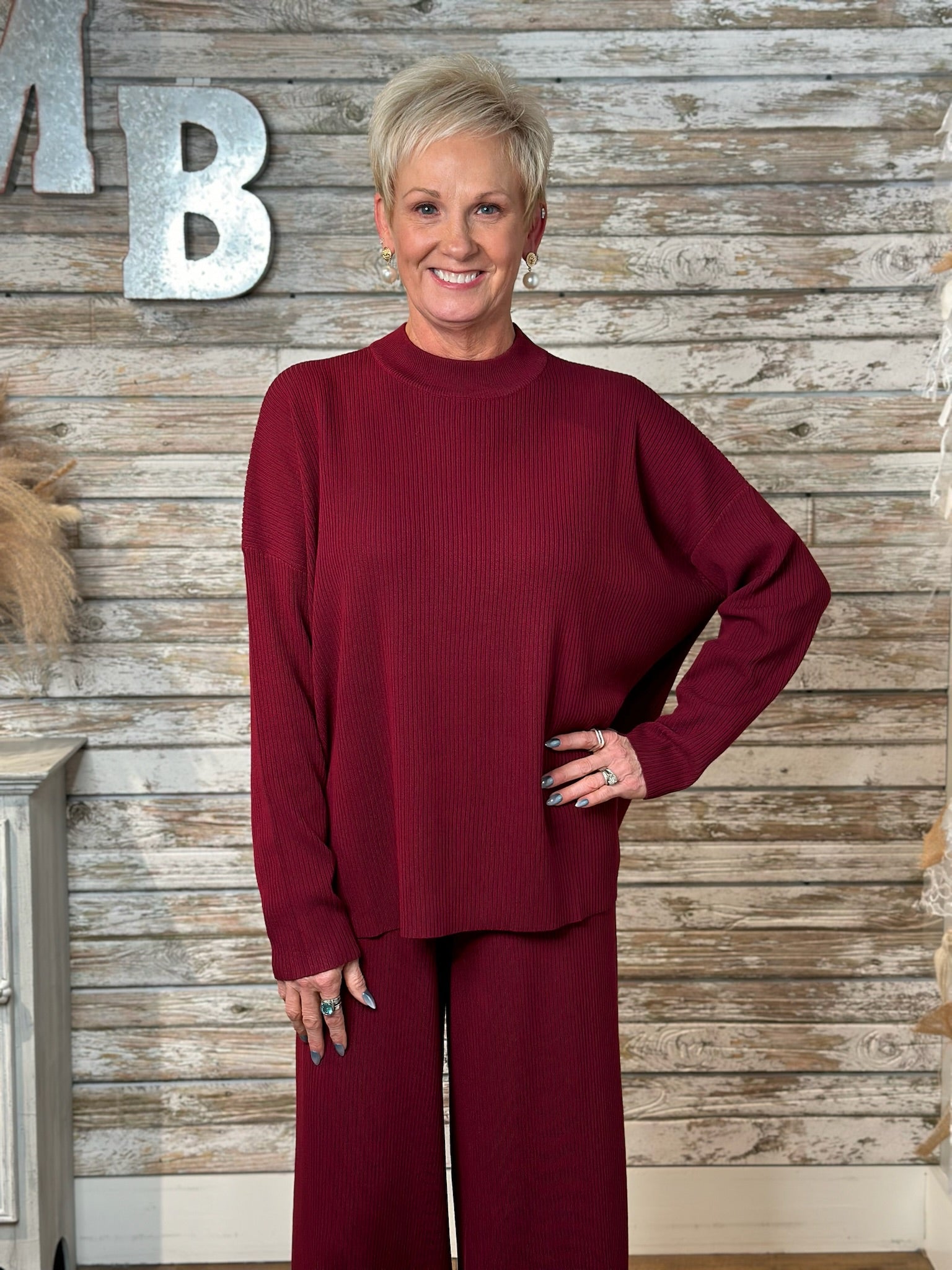 Women wearing a Burgundy Lux Ribbed Viscose Sweater & Wide-Leg Pant Cord Set