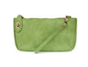 Green leather handbag with a strap on a white background