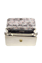 Floral-patterned clutch bag with a white exterior on a white background