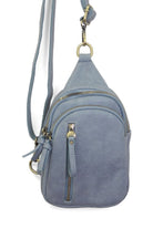 Blue crossbody bag with gold zippers on a white background