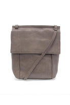 Brown leather crossbody bag on a white background