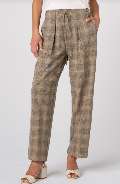 Plaid pants worn by a person on a white background