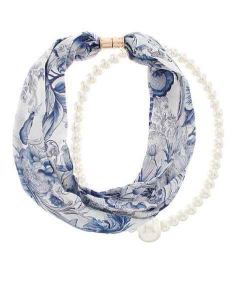 Blue floral headband with pearls on a white background