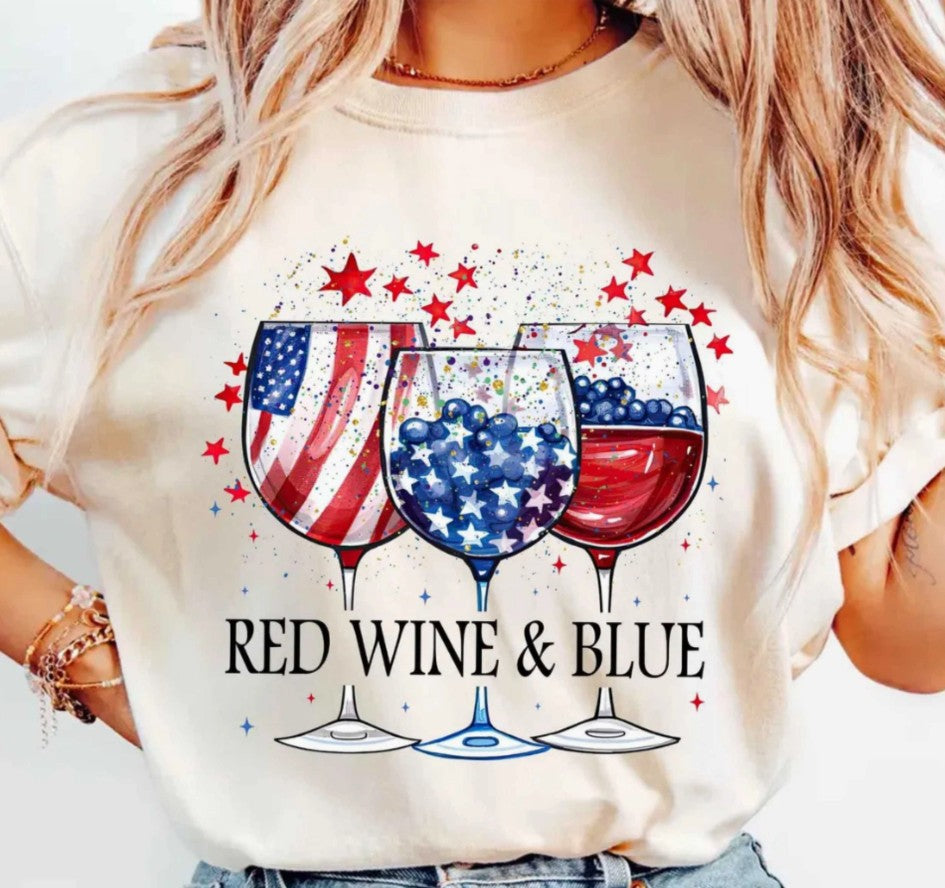 White t-shirt with red, white, and blue wine glass design and 'Red Wine & Blue' text.