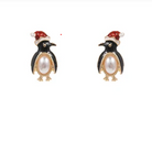 A pair of penguin stud earrings with black and gold enamel, white faux pearls on the bellies, and red Santa hats, shown on a plain white background.