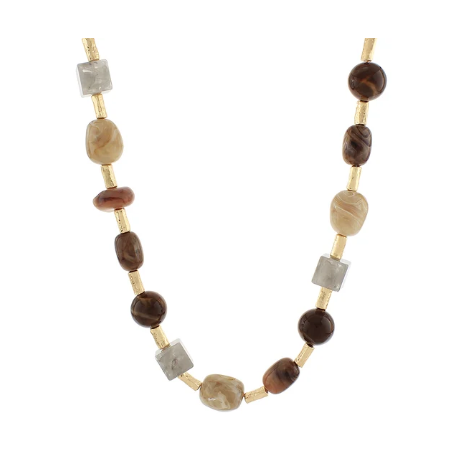 A beaded necklace featuring brown and beige agate-like beads, translucent gray crystal beads, and small gold spacer rings, displayed on a clean white background.